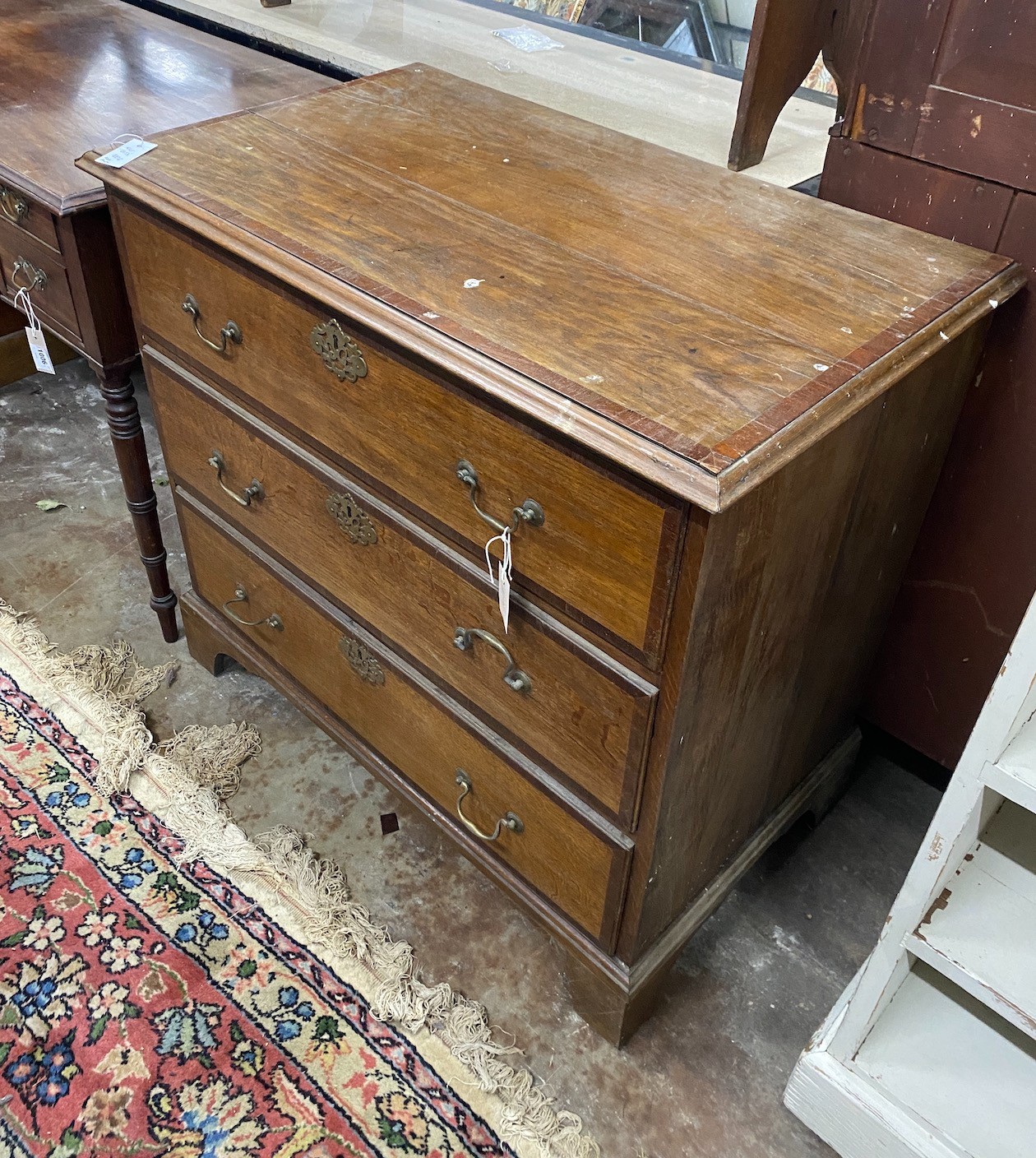A Regency mahogany kneehole dressing table and a George III banded oak chest of three drawers, width 96cm depth 54cm height 87cm